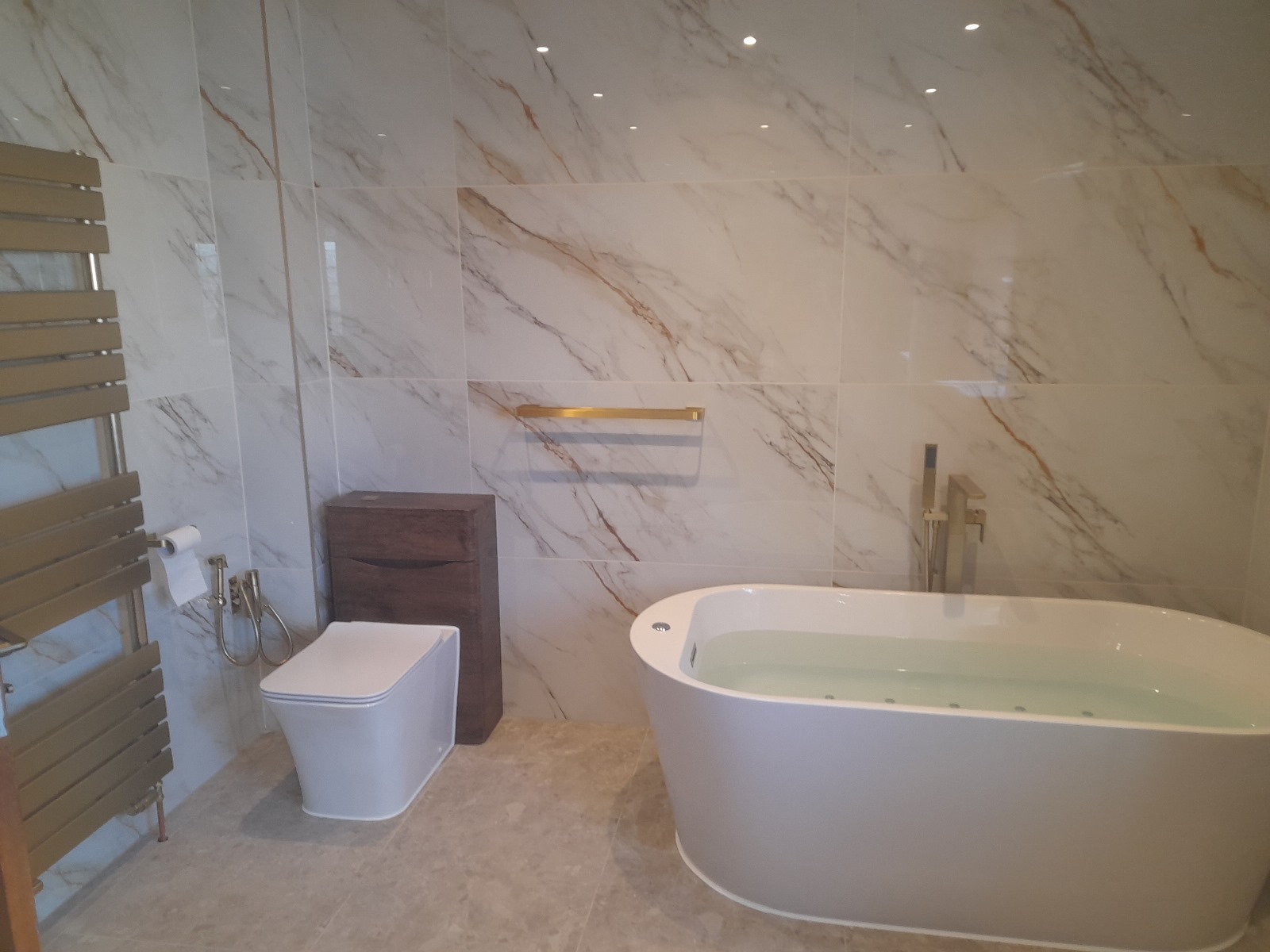 Freestanding Bath with Gold Fixtures